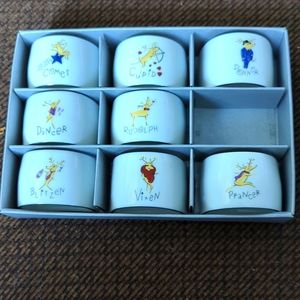 Set of eight ceramic Reindeer Napkin Rings, missing Dasher